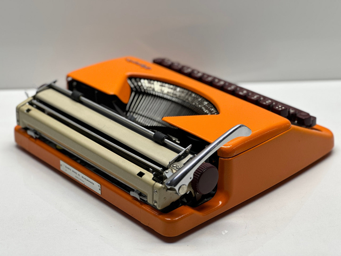Olympia Splendid 33/66 Typewriter - QWERTY Keyboard, Burgundy Keys, Orange Typewriter, and Matching Bag