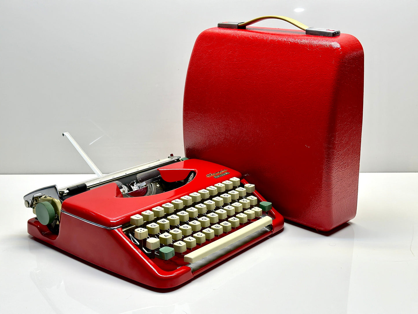 Olympia Splendid 33/66 Typewriter, Red Elegance with Matching Bag and White Keyboard - Vintage Charm from the 1960s