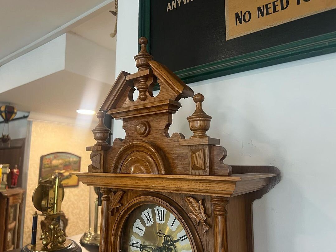 Antique German Metron solid wood wall clock with intricate design in perfect condition