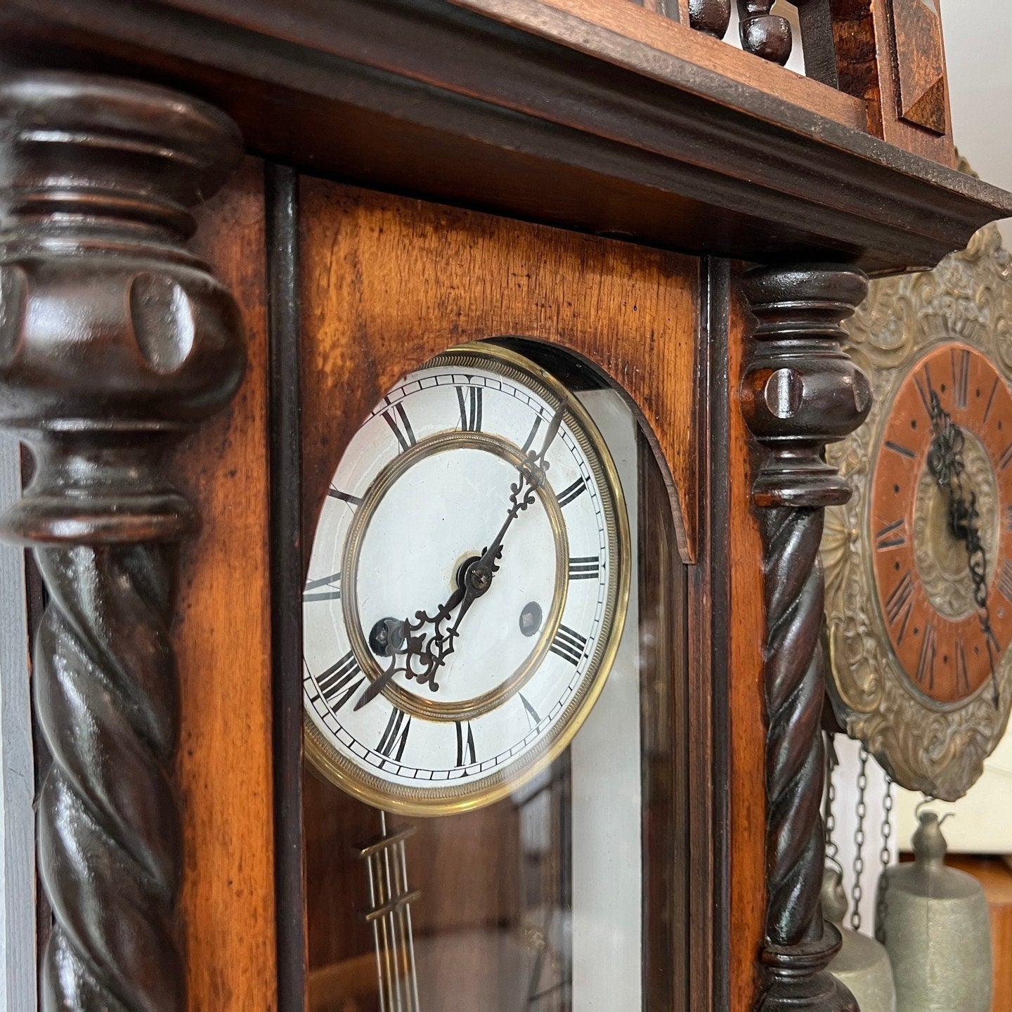 Close-up of Antique Solid Wood Wall Clock with intricate detailing and Roman numerals, perfect condition, collectible and fully functional