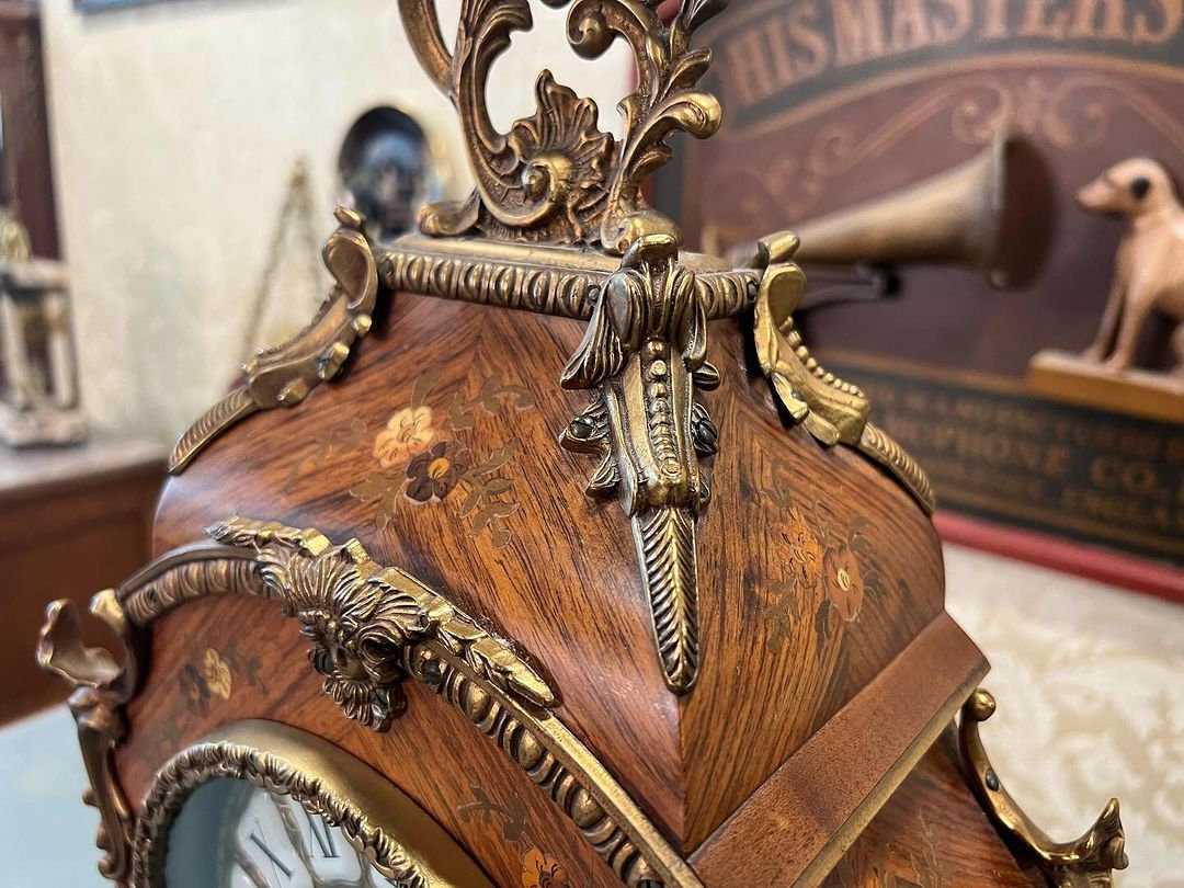 Antique French 1890s marquetry fireplace clock with intricate wood inlay and ornate details in excellent condition.