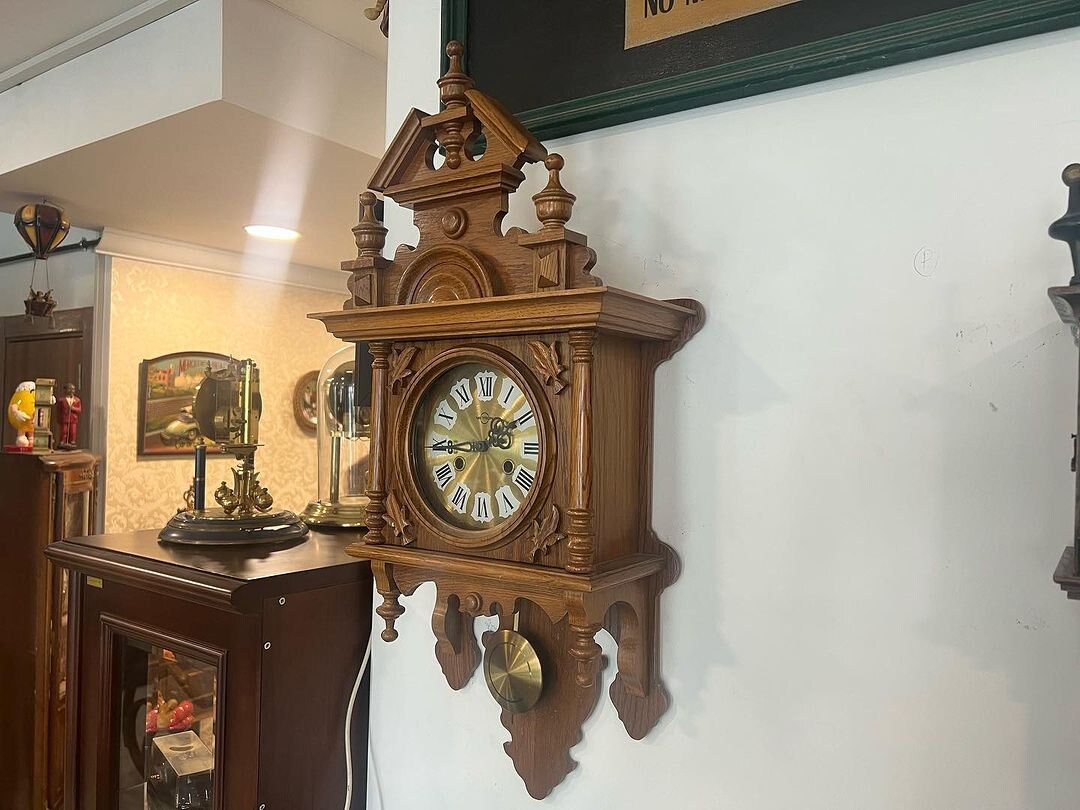 Antique German Metron solid wood wall clock in perfect condition displayed indoors