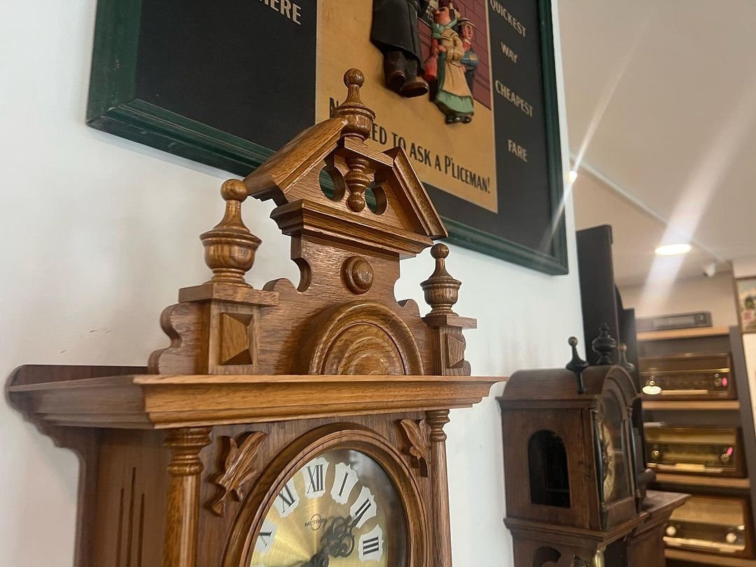 Antique German Metron solid wood wall clock in perfect condition displayed in a collection.