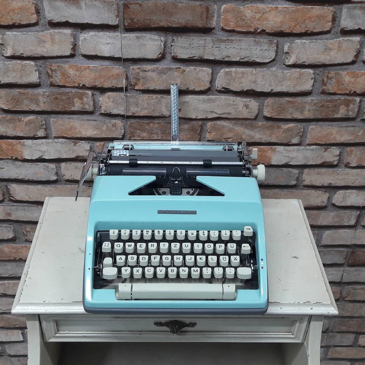 The classic yet vibrant Olympia Colortip 5 Typewriter - A timeless writing companion for the creative mind. Ideal thoughtful gift