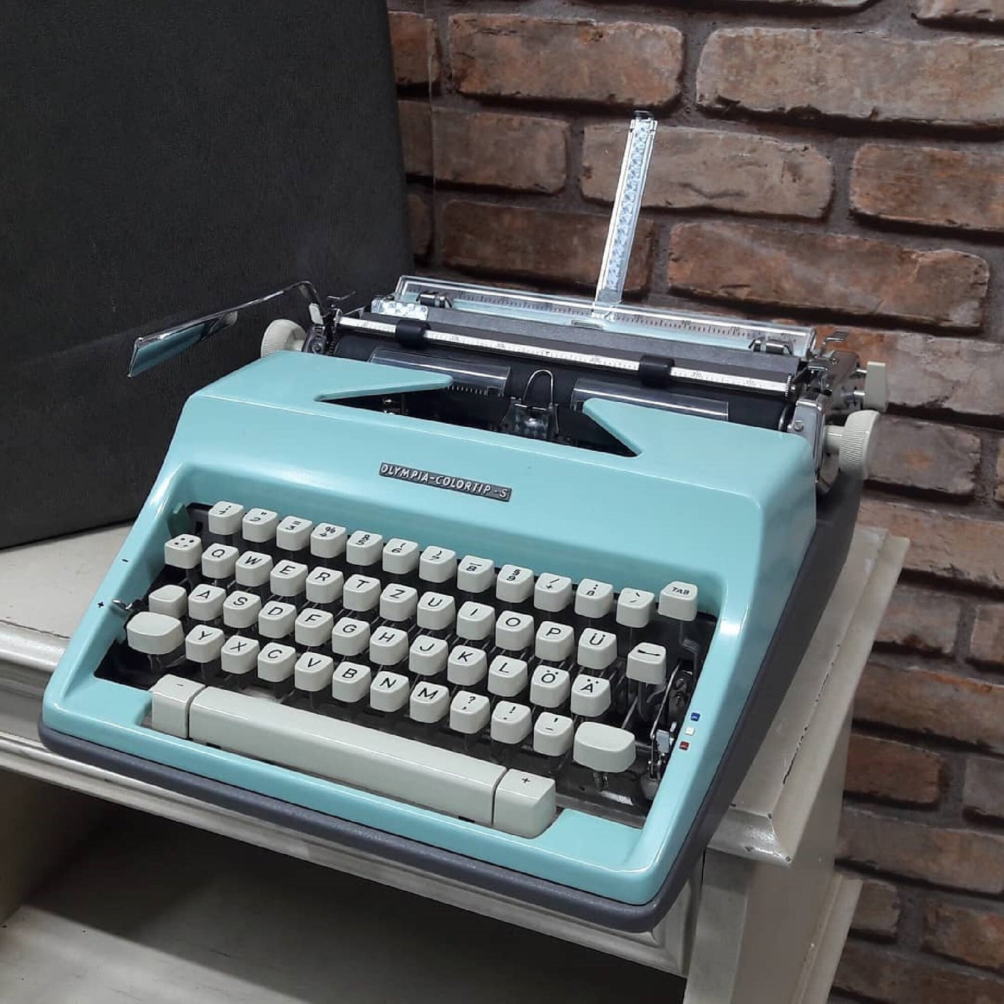 The classic yet vibrant Olympia Colortip 5 Typewriter - A timeless writing companion for the creative mind. Ideal thoughtful gift