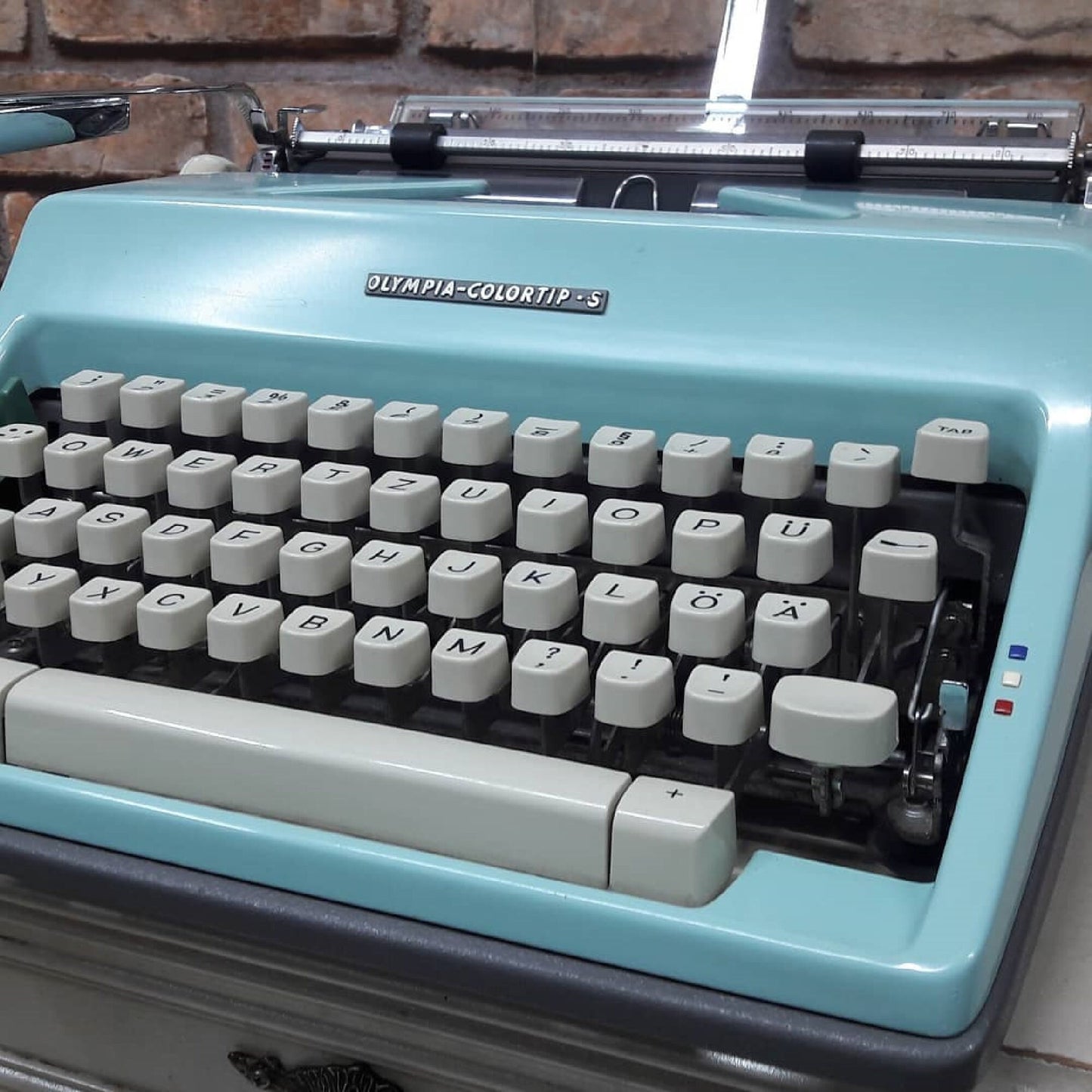 The classic yet vibrant Olympia Colortip 5 Typewriter - A timeless writing companion for the creative mind. Ideal thoughtful gift