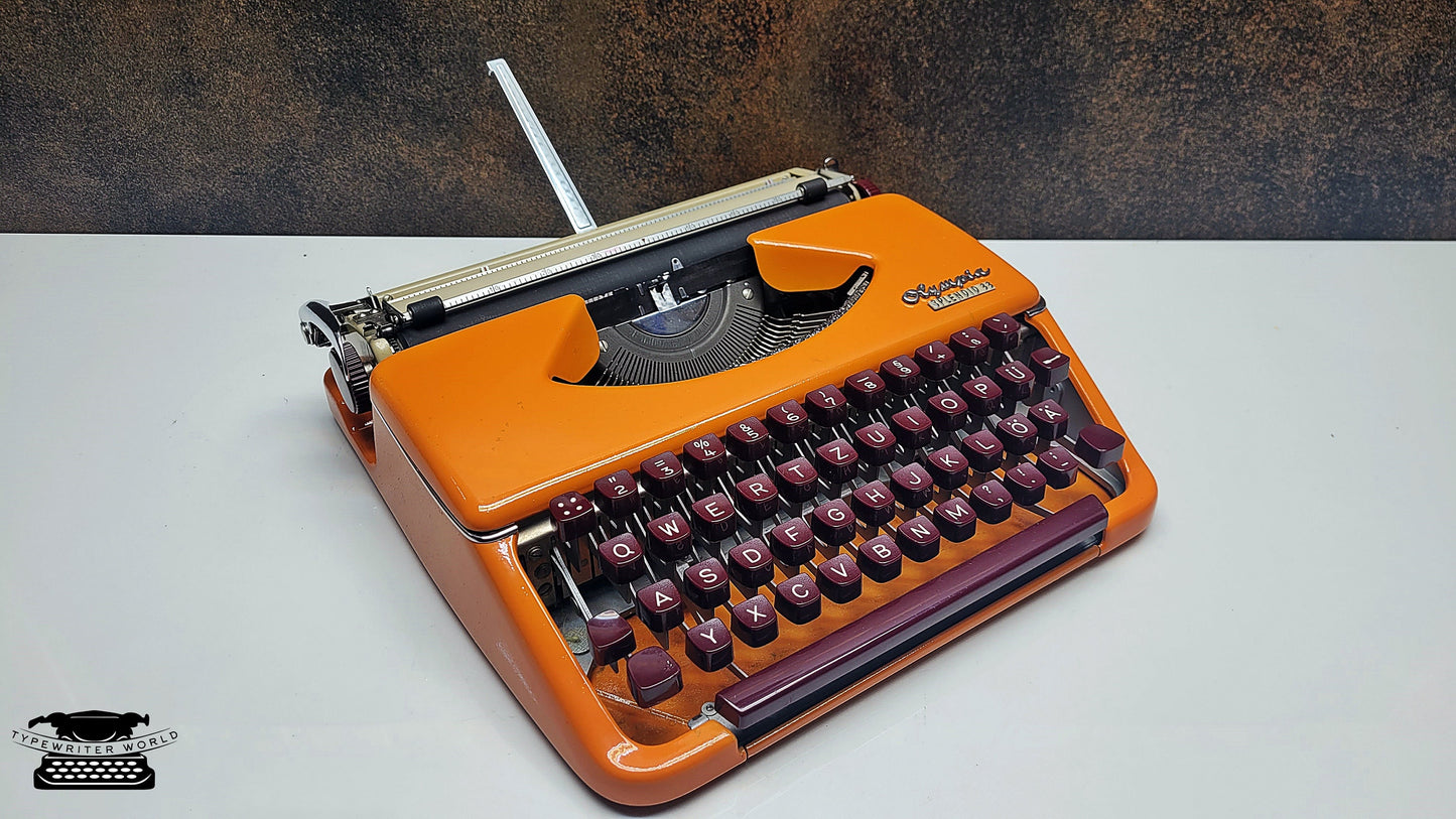 German-Made Olympia Splendid 33/66 Orange Typewriter with Mechanical Burgundy Keyboard and Case | Fully Refurbished Rare Writing Machine