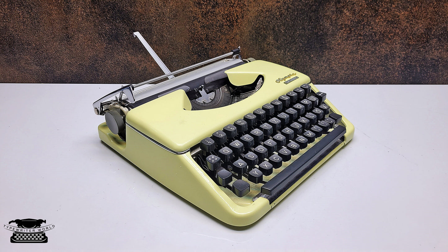 Olympia Splendid 33/66 Vintage Beige Manual Typewriter with Black Keyboard - A Writing Tool for Journalists and Archivists