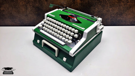 QWERTY Typewriter, Vintage Olympia Traveller Deluxe Typewriter, in Working Condition - Classic Writing Tool for Writers and Collectors.