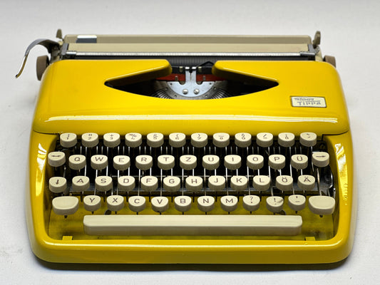 Adler Tippa Typewriter - Vintage 1955 Model in Yellow with QWERTZ Keyboard and Leather Bag