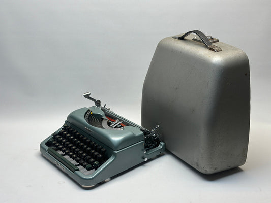 Rentmigon Blue Typewriter - Vintage 1955 Model with QWERTY Layout and Metal Carrying Case