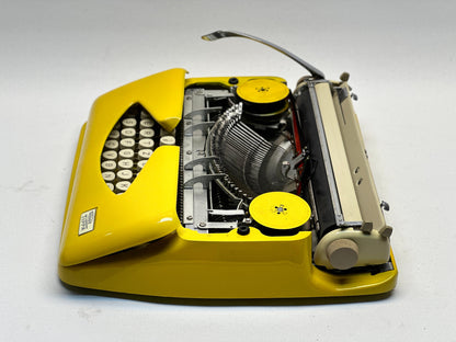Adler Tippa Typewriter - Vintage 1955 Model in Yellow with QWERTZ Keyboard and Leather Bag
