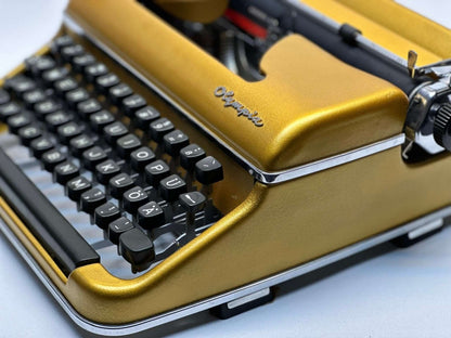 Premium Gold Olympia SM3/SM4 Typewriter - Vintage 1955 Model in Luxurious Gold Finish with QWERTZ Layout
