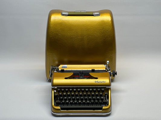 Gold Olympia SM3/SM4 Typewriter - Vintage 1955 Model in Luxurious Condition | Collectible and Functional