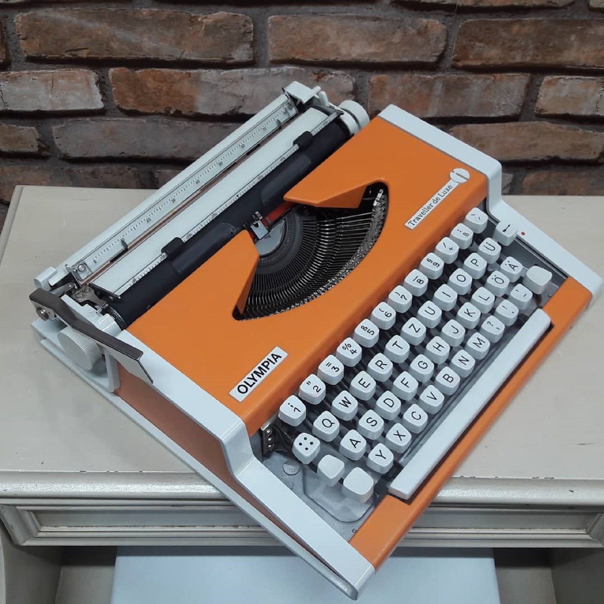 Olympia Traveller Deluxe Typewriter - Fully Functional, Vibrant Orange, and Includes a Stylish White Bag