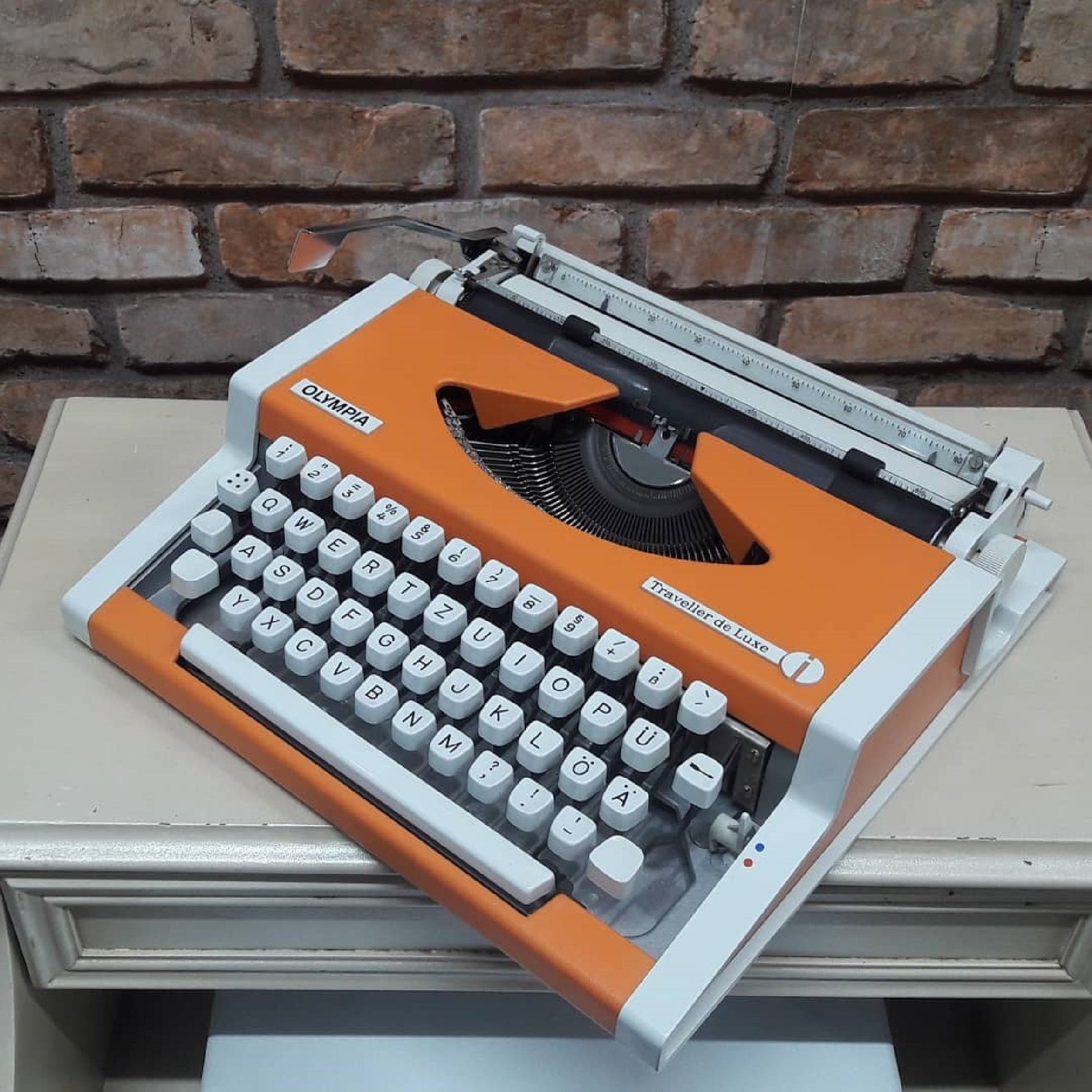 Olympia Traveller Deluxe Typewriter - Fully Functional, Vibrant Orange, and Includes a Stylish White Bag