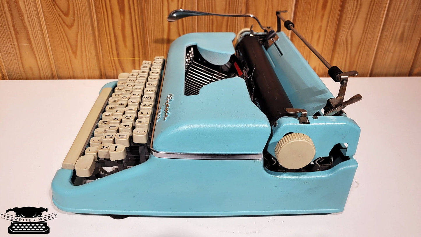 Olympia Monica 1960 Typewriter - Vintage Elegance in Striking Blue