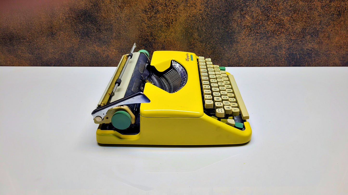 Vintage Olympia Splendid 33/66 Yellow Typewriter - Retro Mechanical Collectible for Office Decor