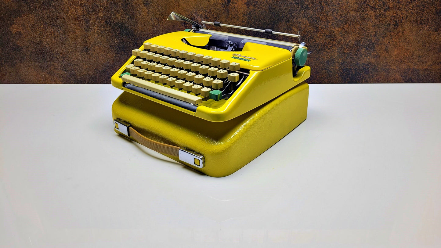 Vintage Olympia Splendid 33/66 Yellow Typewriter - Retro Mechanical Collectible for Office Decor
