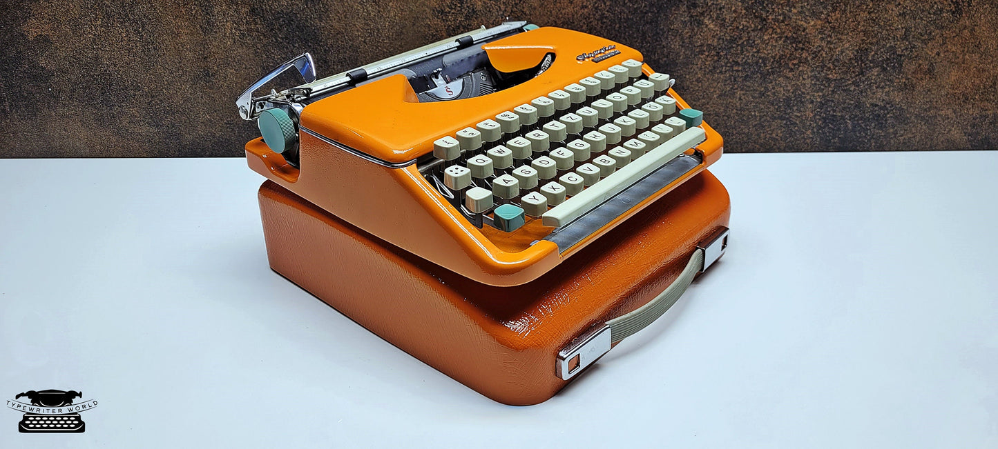 retro writing with the Olympia Splendid 33/66 typewriter orange - a fully refurbished vintage writing machine with a matching carrying case.