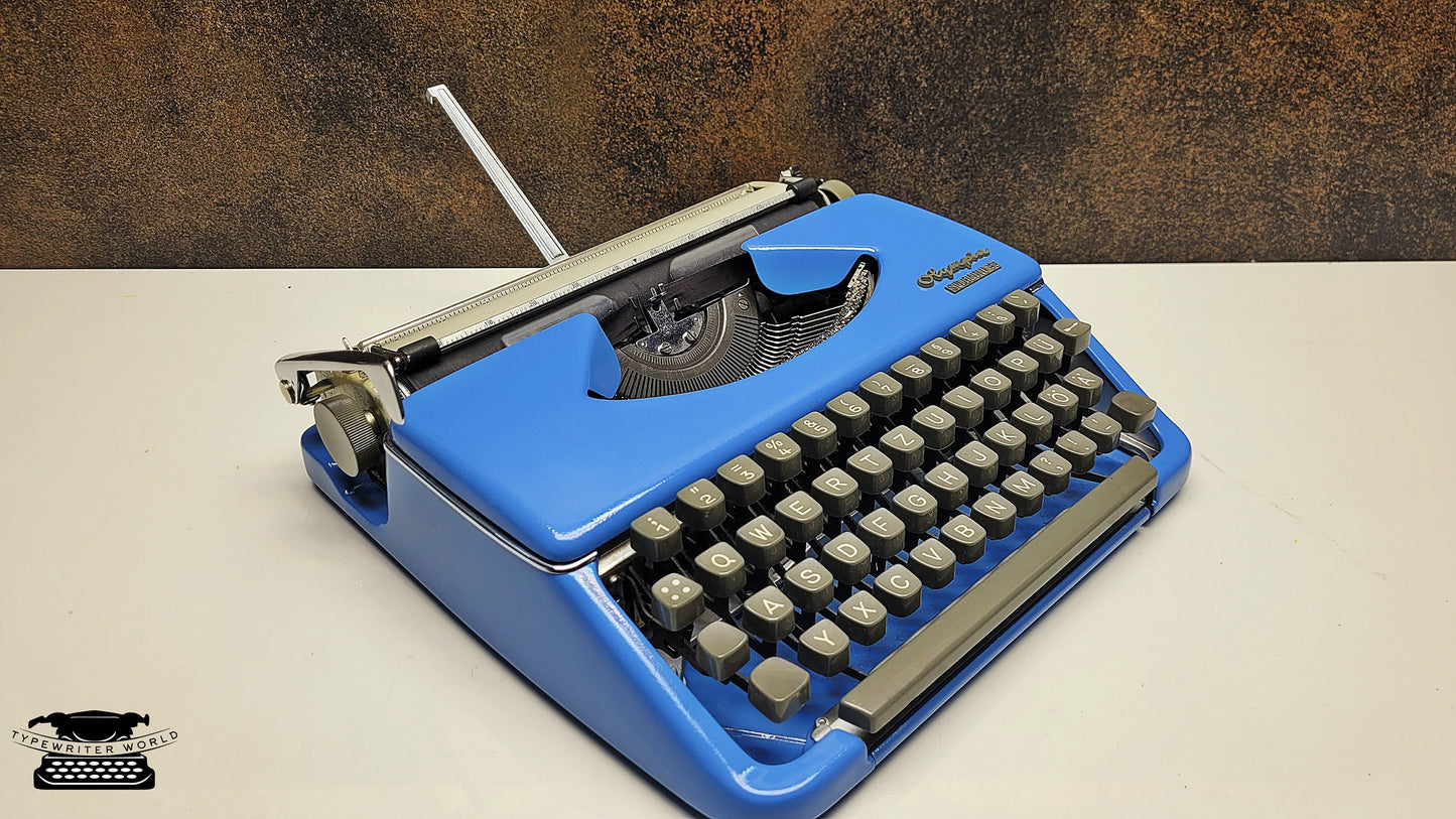 Vintage Olympia Splendid 33/66 Vintage Blue Typewriter - The Perfect Writing Tool for Authors and Collectors