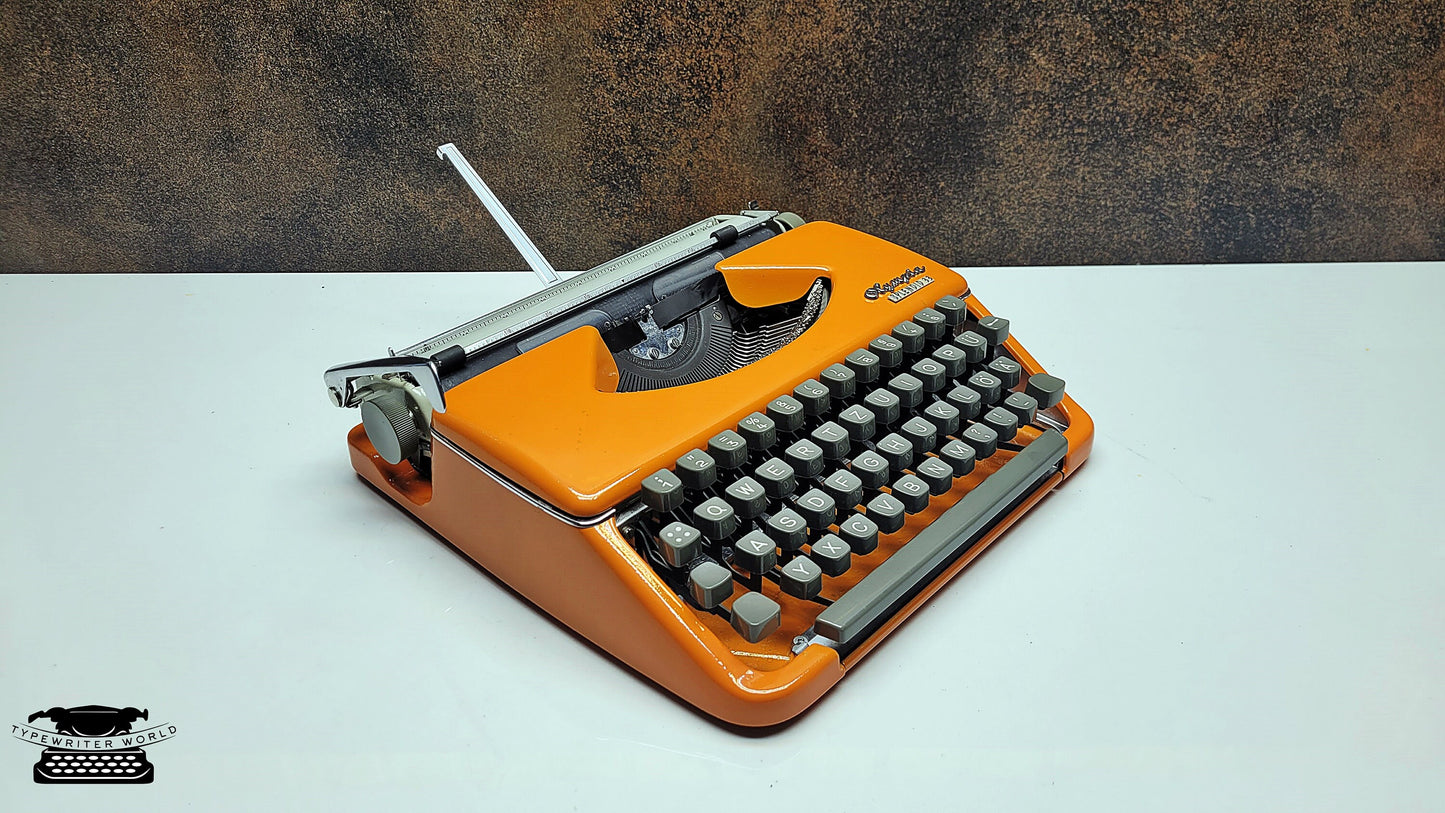 Vintage Olympia Splendid 33/66 Vintage Orange Typewriter - A Unique Crafting Tool for Scrapbookers and DIY Enthusiasts