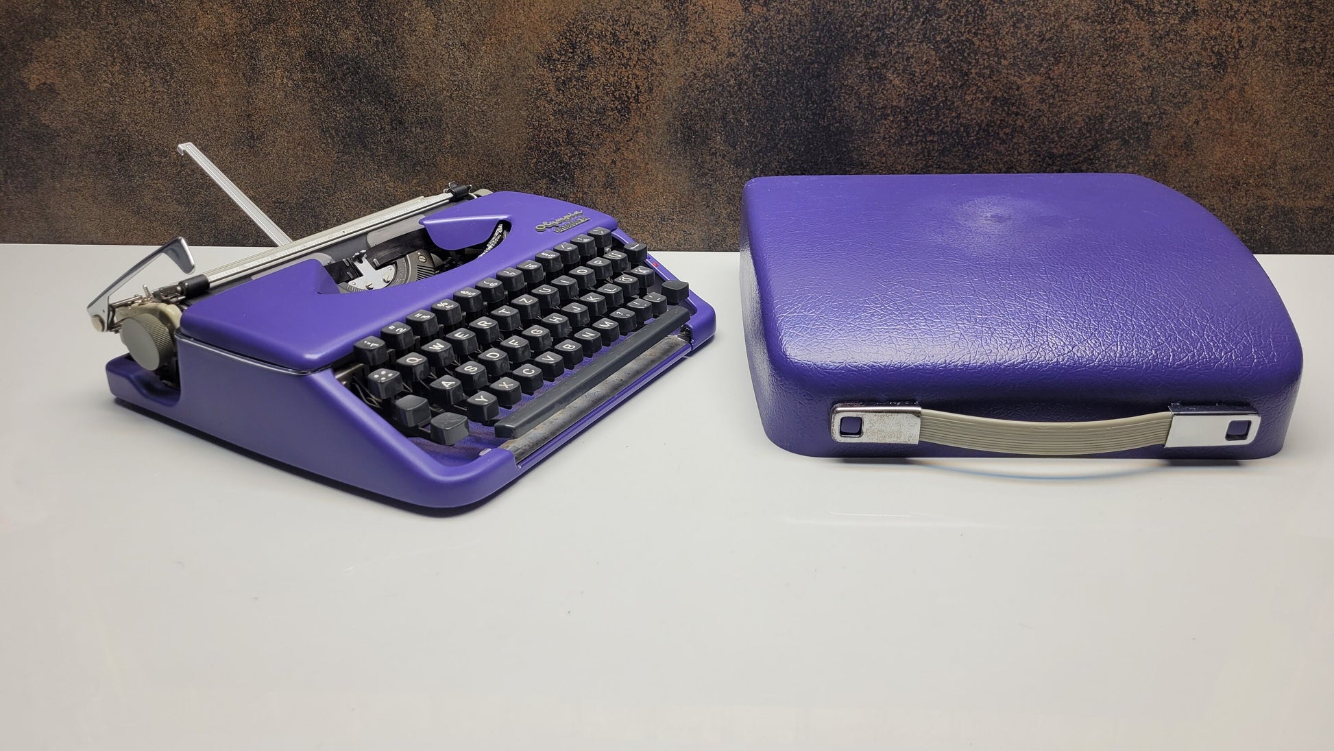 Vintage Olympia Splendid 33/66 Purple Typewriter with Grey Keyboard - A Unique Tool for Typographic Designers