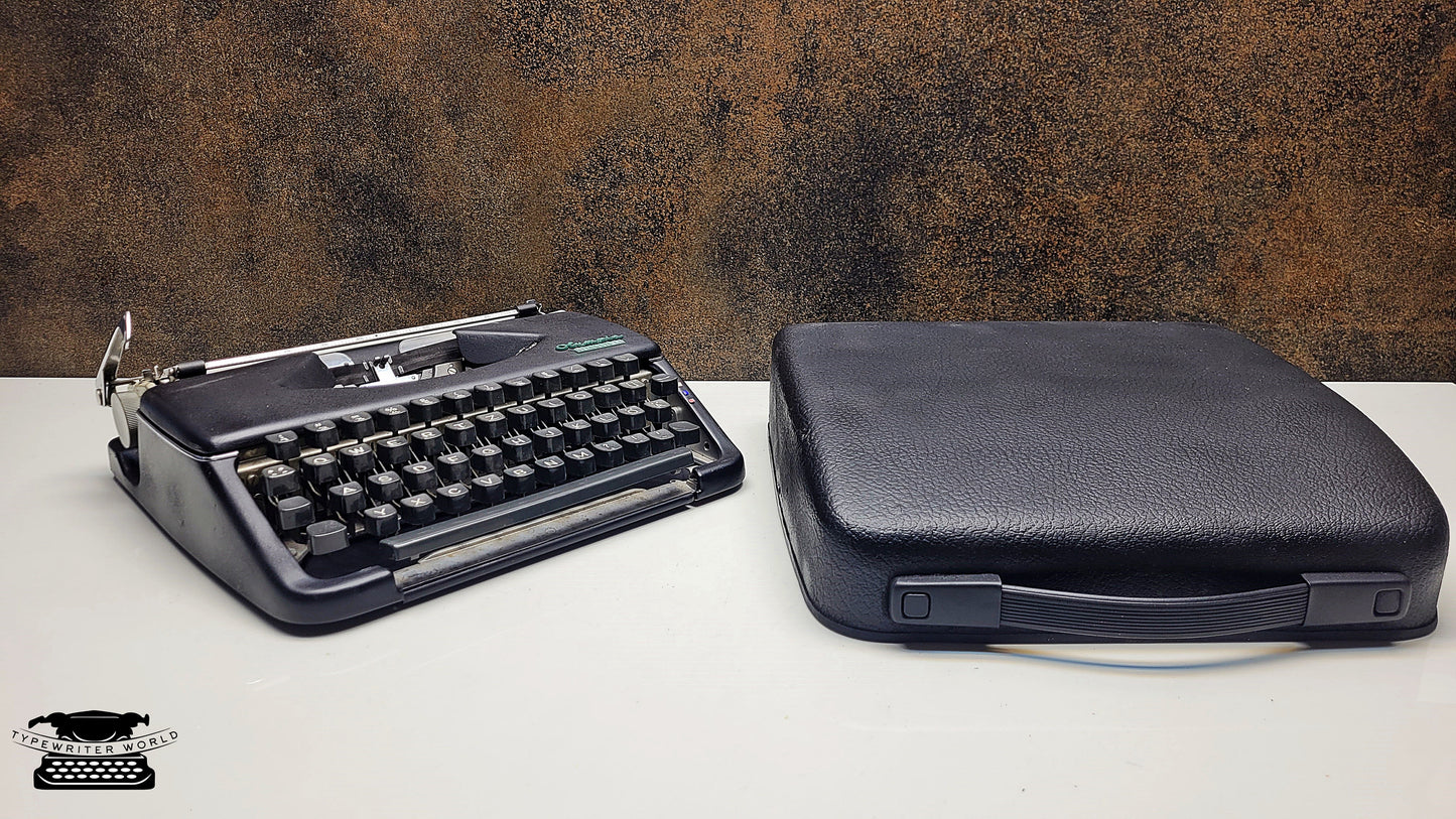 Vintage Olympia Splendid 33/66 Portable Black Typewriter with Black Keyboard - A Must-Have for Typewriter Enthusiasts and Collectors