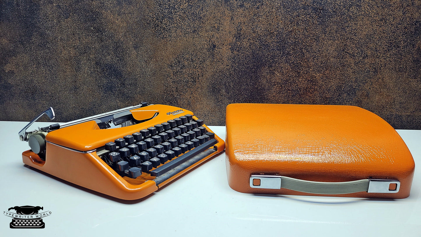 Vintage Olympia Splendid 33/66 Orange Typewriter with Black Keyboard - An Elegant Writing Tool for Love Letters and Personalized Notes
