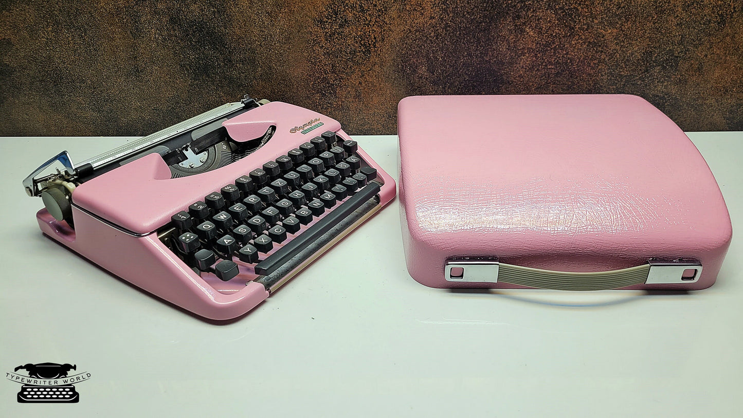 Portable Olympia Splendid 33/66 Vintage Ice Pink Typewriter with Black Keyboard - Ideal for Traveling Writers and Students