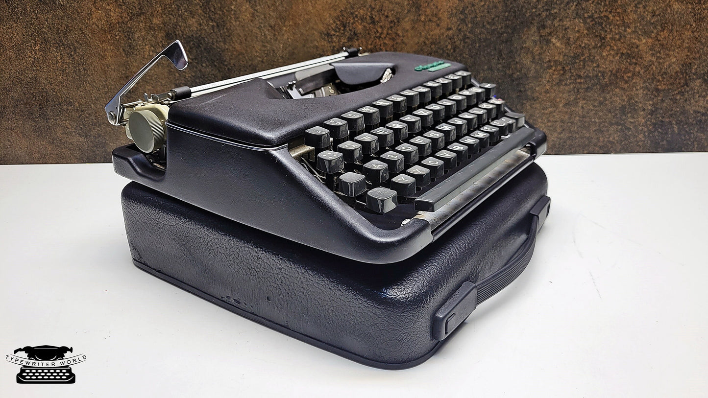 Vintage Olympia Splendid 33/66 Portable Black Typewriter with Black Keyboard - A Must-Have for Typewriter Enthusiasts and Collectors