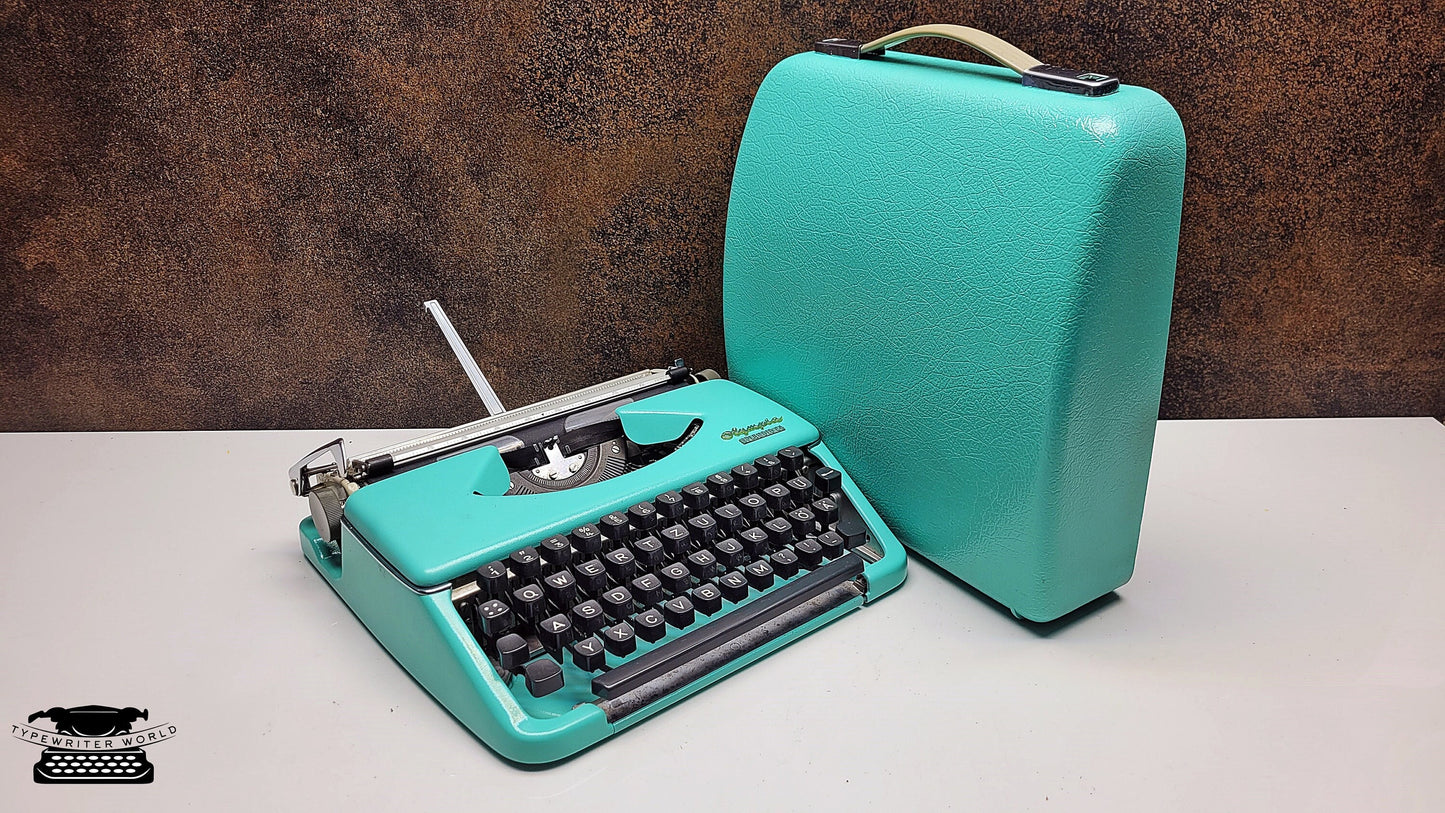 Olympia Splendid 33/66 Vintage Turquoise  Manual Typewriter with Black Keyboard - A Writing Tool for Journalists and Archivists