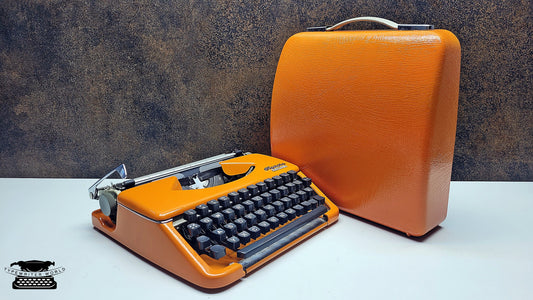 Vintage Olympia Splendid 33/66 Orange Typewriter with Black Keyboard - An Elegant Writing Tool for Love Letters and Personalized Notes